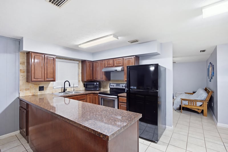 Kitchen with island and granite counters at 417 Capricorn Ln, Orange Park, FL 32073