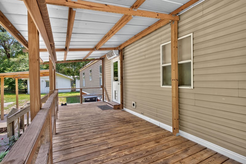 Covered deck along the back of the home at 2549 Snapdragon Ave, Middleburg, FL 32068