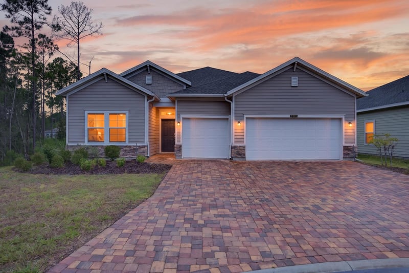 Front exterior at day-to-dusk at 9905 Ansley Lake Dr, Jacksonville, FL