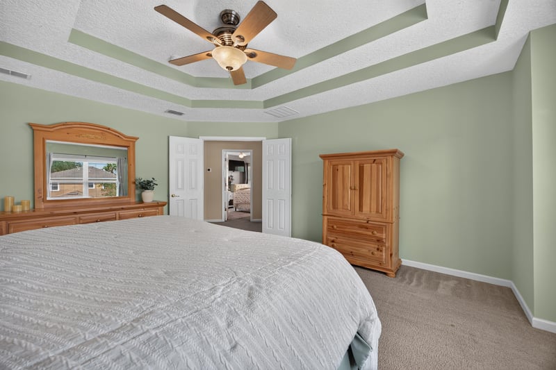 Primary bedroom with tray ceiling detail at 3660 Middlebrook Dr, Orange Park, FL 32065