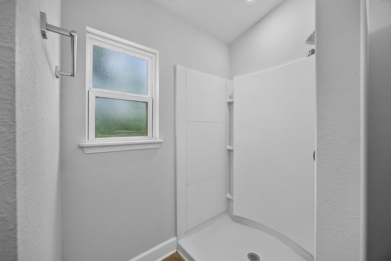 Bathroom with walk-in shower at 9846 Olivia St, Jacksonville, FL