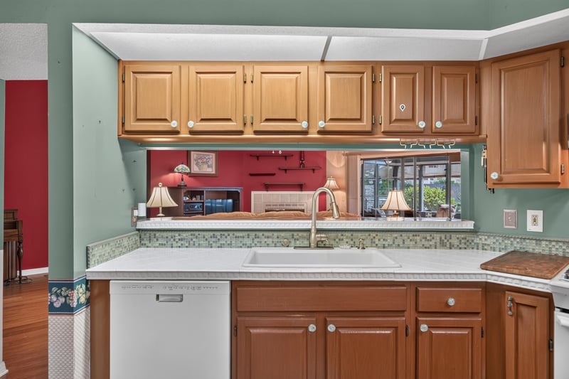 Kitchen pass-through window to living room at 4837 Pareja Ct, Jacksonville, FL 32225