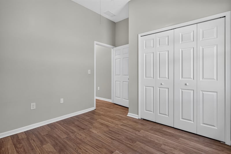 Primary bedroom with vaulted ceiling and closet at 8196 Cabin Lake Cir, Jacksonville, FL 32256
