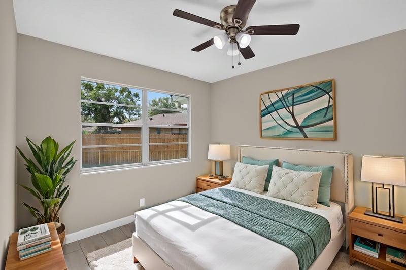 Bedroom with virtually staged bed and window at 4117 Wilcrest Ct, Jacksonville, FL 32277