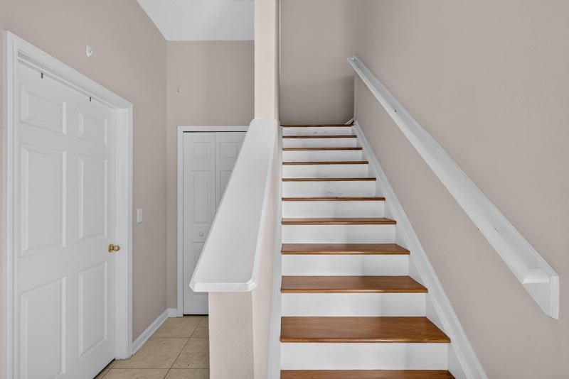 Tiled entry foyer with staircase at 7047 Deer Lodge Cir, Jacksonville