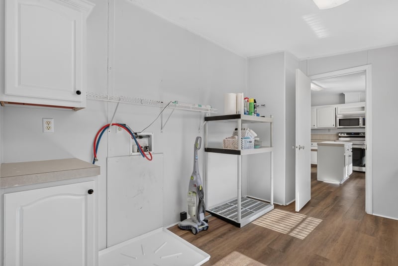 Laundry area with shelving at 3215 Robin Ln, Middleburg, FL