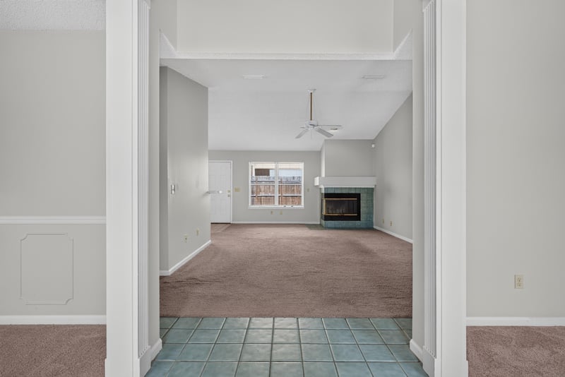 Interior entry with tile floor and sightline to living room and fireplace at 400 Ashcroft Landing Dr, Jacksonville, FL 32225