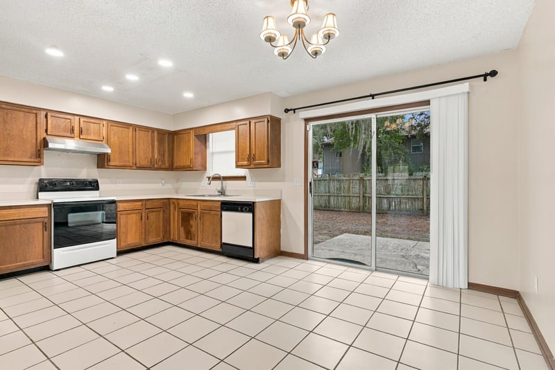 Kitchen with tile flooring and cabinetry, photographed by Megapixeler on Blue Teal Ct, Jacksonville