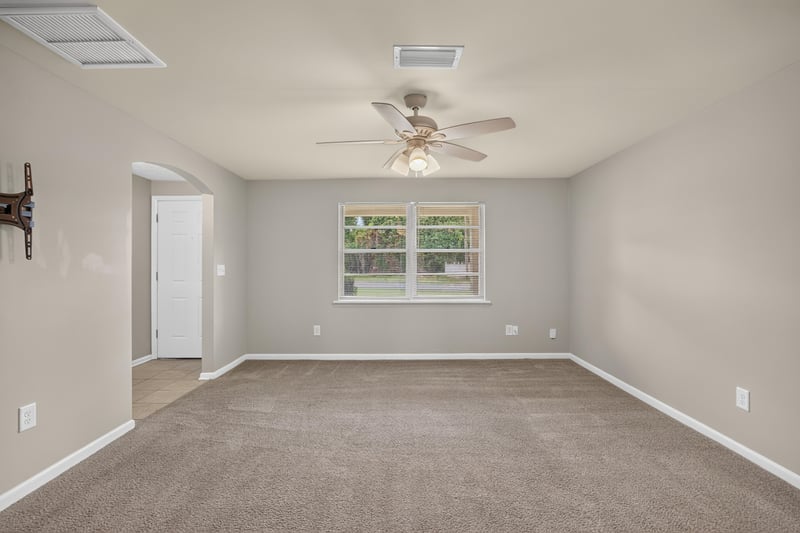 Living room with ceiling fan and window view at 1143 Tumbleweed Dr, Orange Park, FL 32065