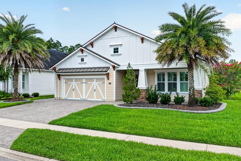 Front exterior showing gabled roofline and landscaped lawn at 186 Freshwater Dr