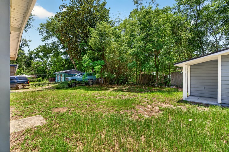 View from the outbuilding toward the street at 1928 Montmarte Dr, Jacksonville, FL 32210