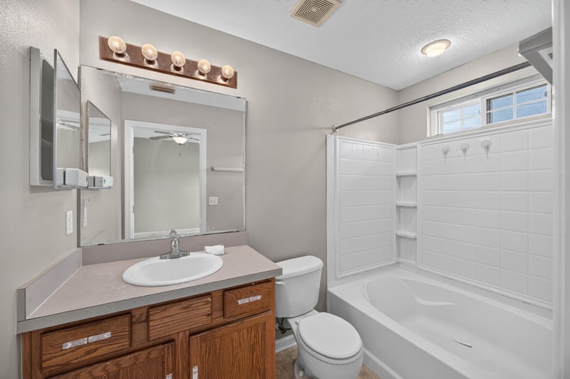 Bathroom with vanity and tub-shower combo at 1572 Biscayne Bay Dr, Jacksonville, FL 32218