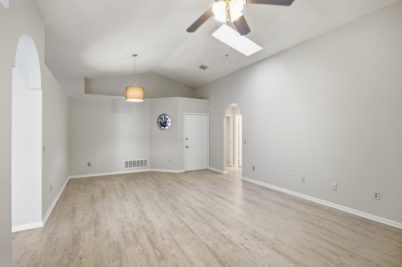 Living area with skylight and ceiling fan at 678 5th Ave N, Jacksonville Beach, FL 32250