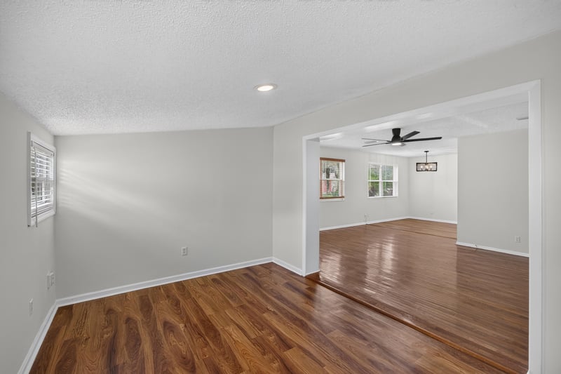 Dining and living area with wood floor and ceiling fan at 4039 Habana Ave, Jacksonville, FL