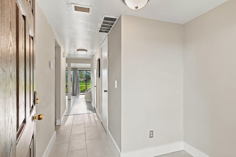 Tiled entry hallway leading inside at 7703 Las Palmas Way