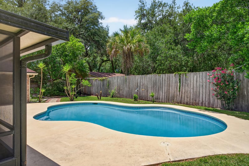 Backyard pool and covered patio at 12810 Swamp Owl Ln