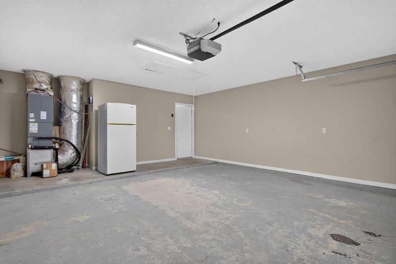 Garage interior with storage area at 12949 Chets Creek Dr S, Jacksonville, FL 32224
