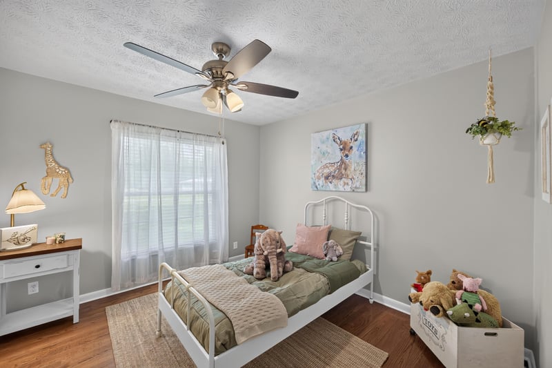 Bedroom with white dresser and deer wall art at 5843 Ovella Rd, Jacksonville, FL 32244