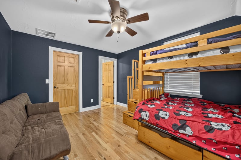 Bedroom with bunk beds and navy walls at 1735 Hagans Ridge Ct