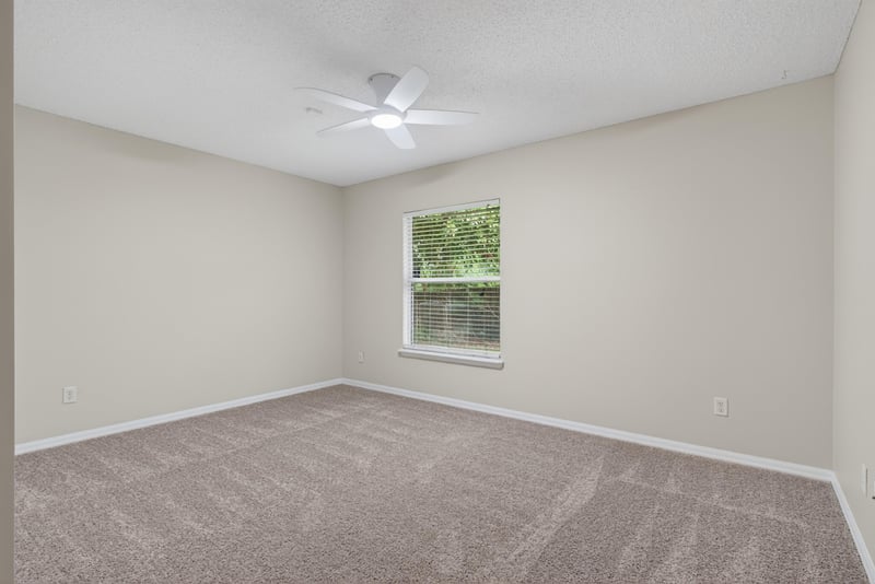 Bedroom with carpet and window at 1648 Glen Laurel Dr, Middleburg, FL 32068
