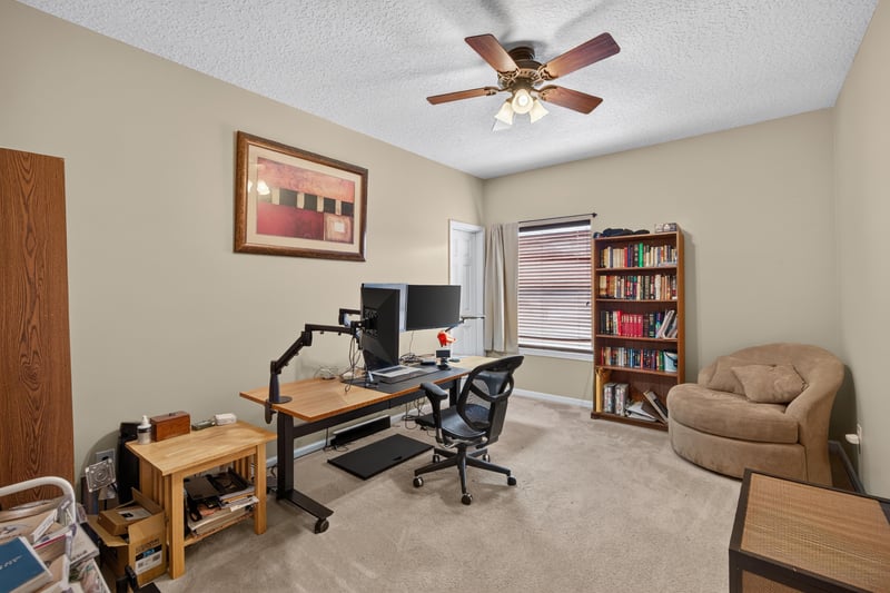 Bedroom with desk and bookshelf at 2875 Pebblewood Ln, Orange Park, FL 32065