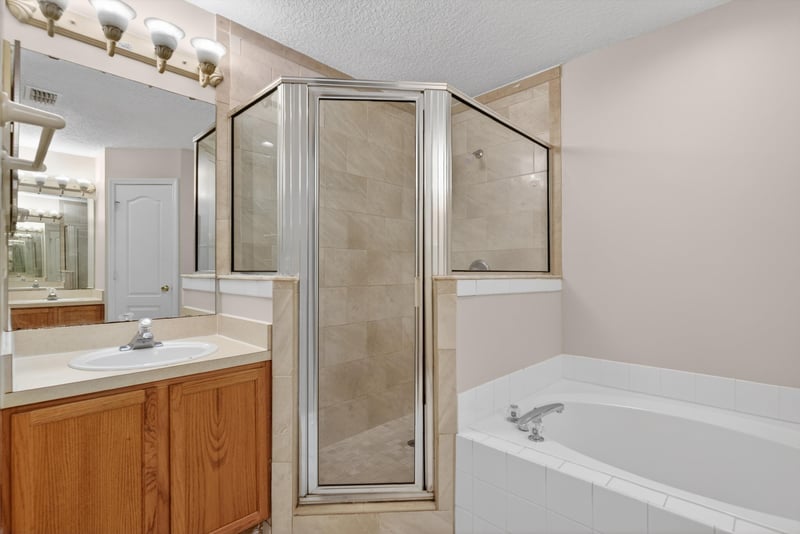Bathroom with walk-in shower, soaking tub and vanity at 1648 Glen Laurel Dr, Middleburg, FL 32068