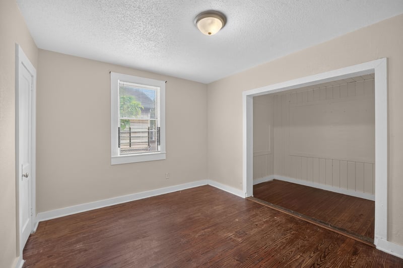 Empty bedroom with wood floors and window at 1473 State St W, Jacksonville, FL 32209