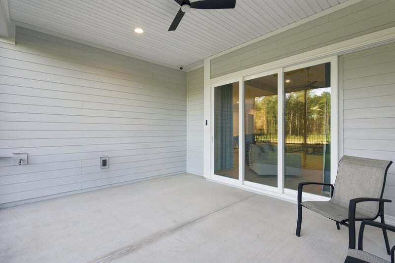 Sliding glass doors from living room to covered patio at 27 Holly Rdg Wy, St. Augustine, FL