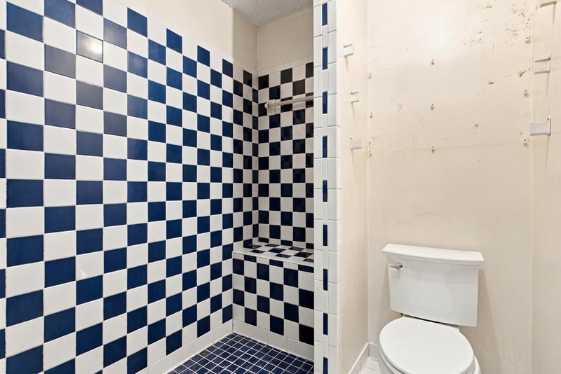 Bathroom shower with blue and white checkered tile at 2915 Trenton Ct, Orange Park, FL