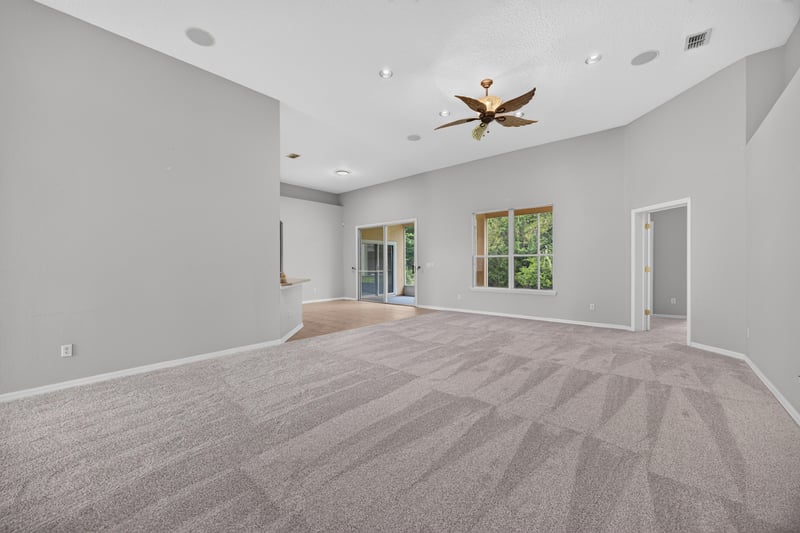 Living room with vaulted ceiling and ceiling fan at 635 Wakeview Dr, Orange Park, FL 32065