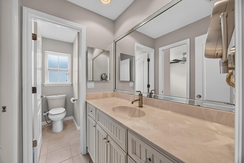 Bathroom with vanity and window at 117 Island Cottage Way, St. Augustine, FL 32080