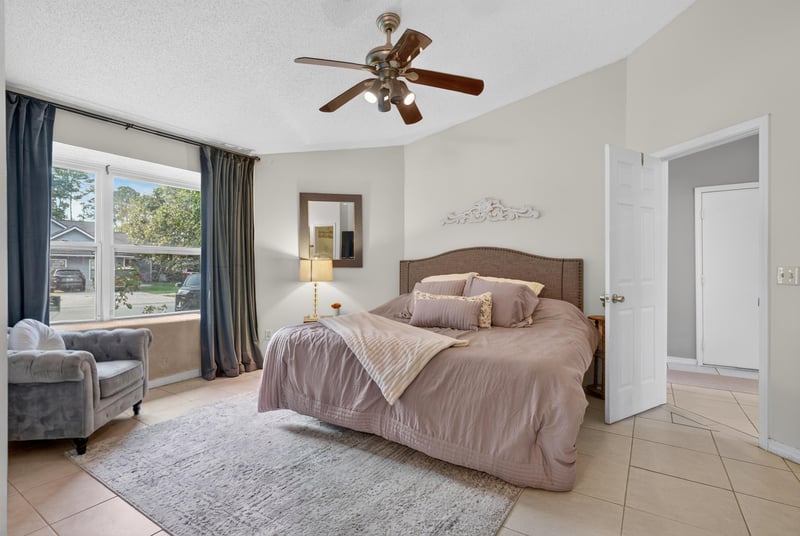 Bedroom with bed and ceiling fan at 13020 Medford Ln, Jacksonville, FL 32225