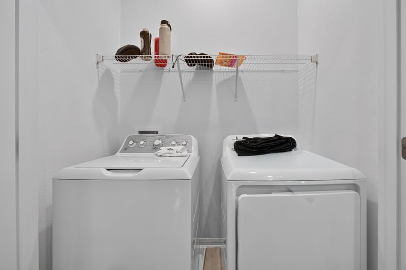 Laundry closet with stacked washer and dryer at 339 Anthony Dr, Jacksonville, FL