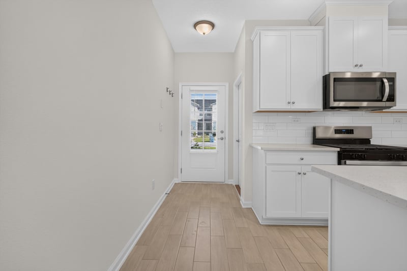 Kitchen entry with wood floor at 39 Mellowood Ln, St. Augustine, FL 32092
