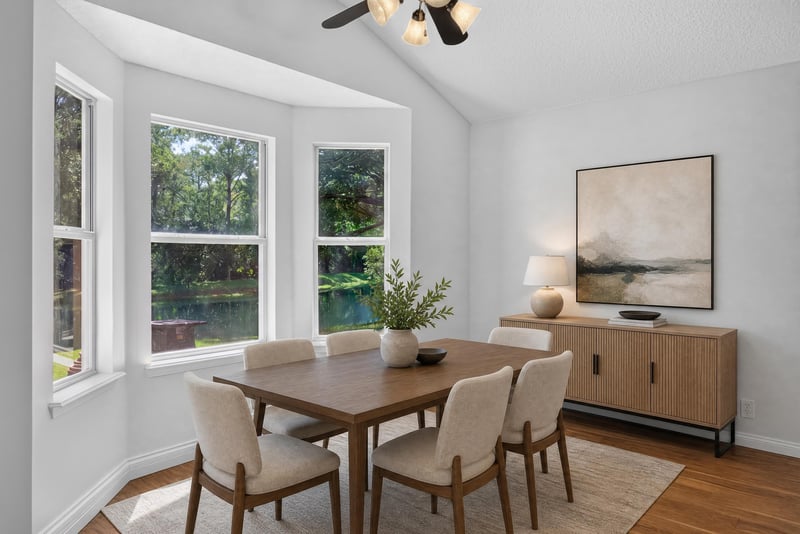 Breakfast nook with bay window and pond view at 11675 Magnolia Estates Rd, Jacksonville, FL 32223