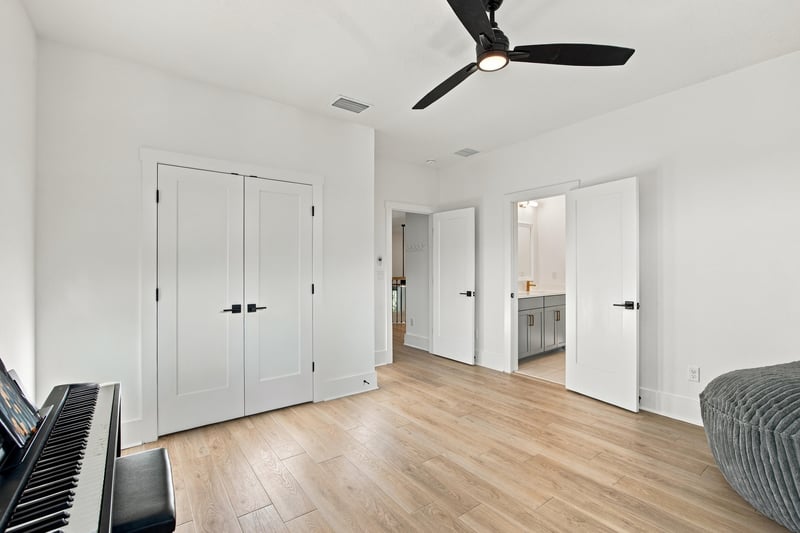 Bedroom with closet doors and piano at 907 Seagrove Dr, Ponte Vedra Beach, FL 32081