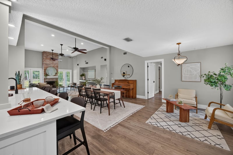 Open kitchen, dining, and living area at 1161 Whispering Pines Rd, Jacksonville, FL 32259