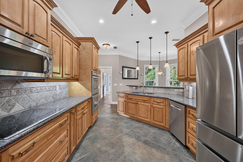 Kitchen with stainless appliances and pendant lights at 1735 Hagans Ridge Ct