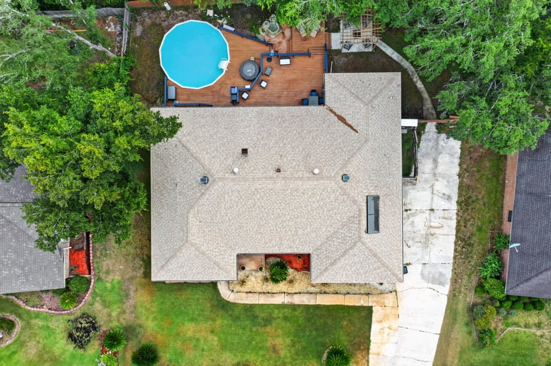 Drone view of backyard pool and deck at 981 Marble Ridge Dr, Orange Park, FL 32065