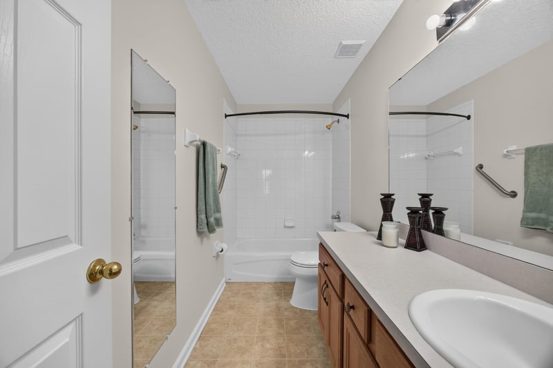 Primary bathroom vanity and mirror at 605 N Covered Bridge Rd, Jacksonville, FL