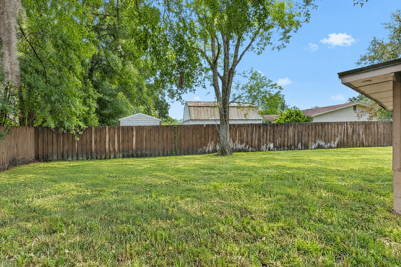 Backyard with fence and open lawn at 1435 Undine Ave, Jacksonville, FL