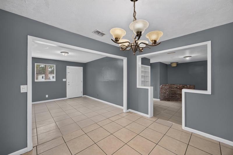 Den with tile floor and pass-through opening at 6745 Jack Horner Ln, Jacksonville, FL 32210