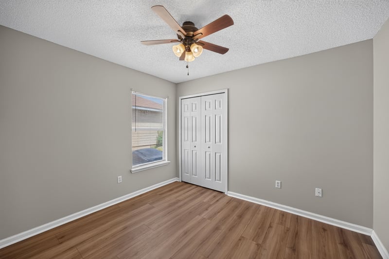 Bedroom with wood floor and closet at 9256 Dale View Ln W, Jacksonville, FL 32225