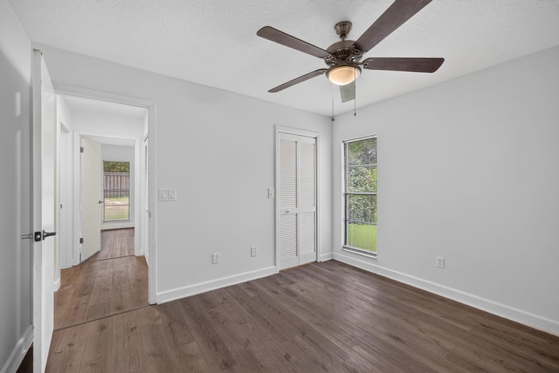 Hallway with ceiling fan and wood floor at 551 Deltona Blvd, St. Augustine, FL 32086