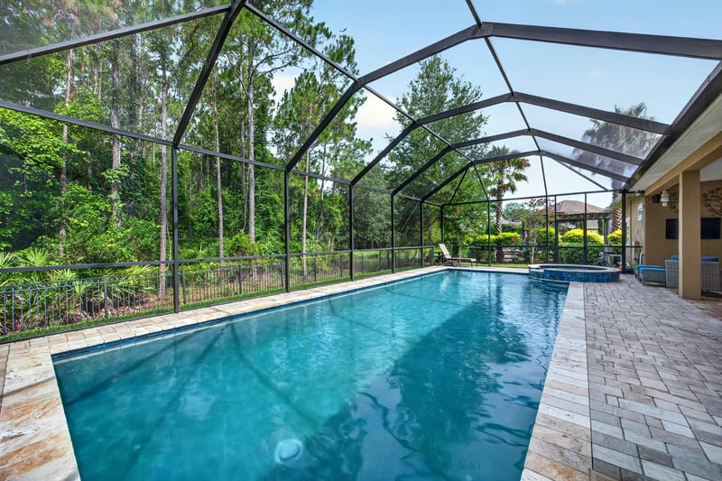 Aerial view of screened pool and paver patio at 276 Cross Ridge Dr, Ponte Vedra Beach, FL 32081