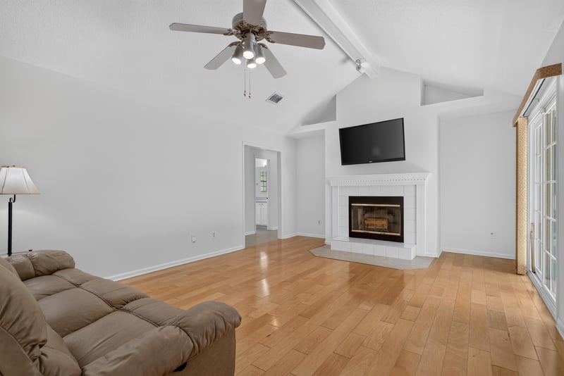 Family room with ceiling fan and sofa at 12810 Swamp Owl Ln