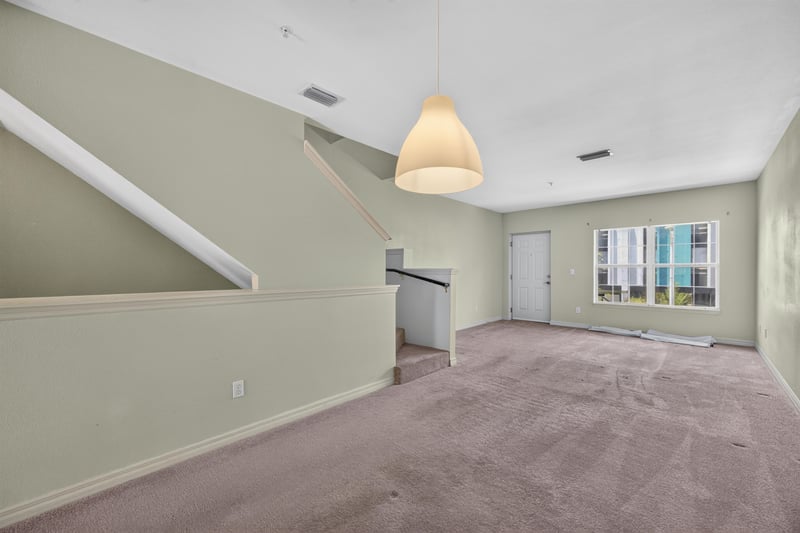 Dining area with pendant light and staircase at 342 E Ashley St, Jacksonville, FL 32202