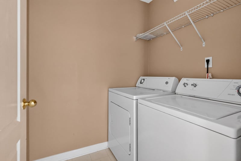 Laundry closet with washer and dryer at 12359 Mangrove Forest Ct, Jacksonville, FL 32218