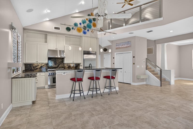 Kitchen island with view toward staircase at 117 Island Cottage Way, St. Augustine, FL 32080