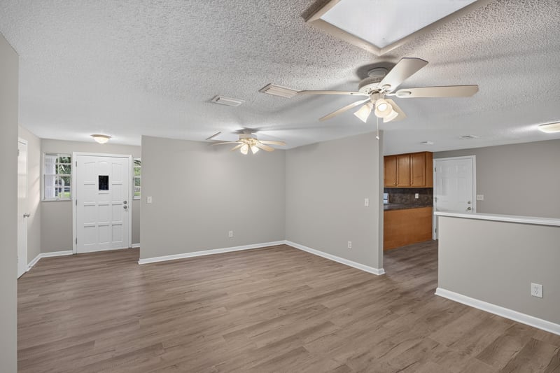 Open living and kitchen area with ceiling fan at 1435 Undine Ave, Jacksonville, FL